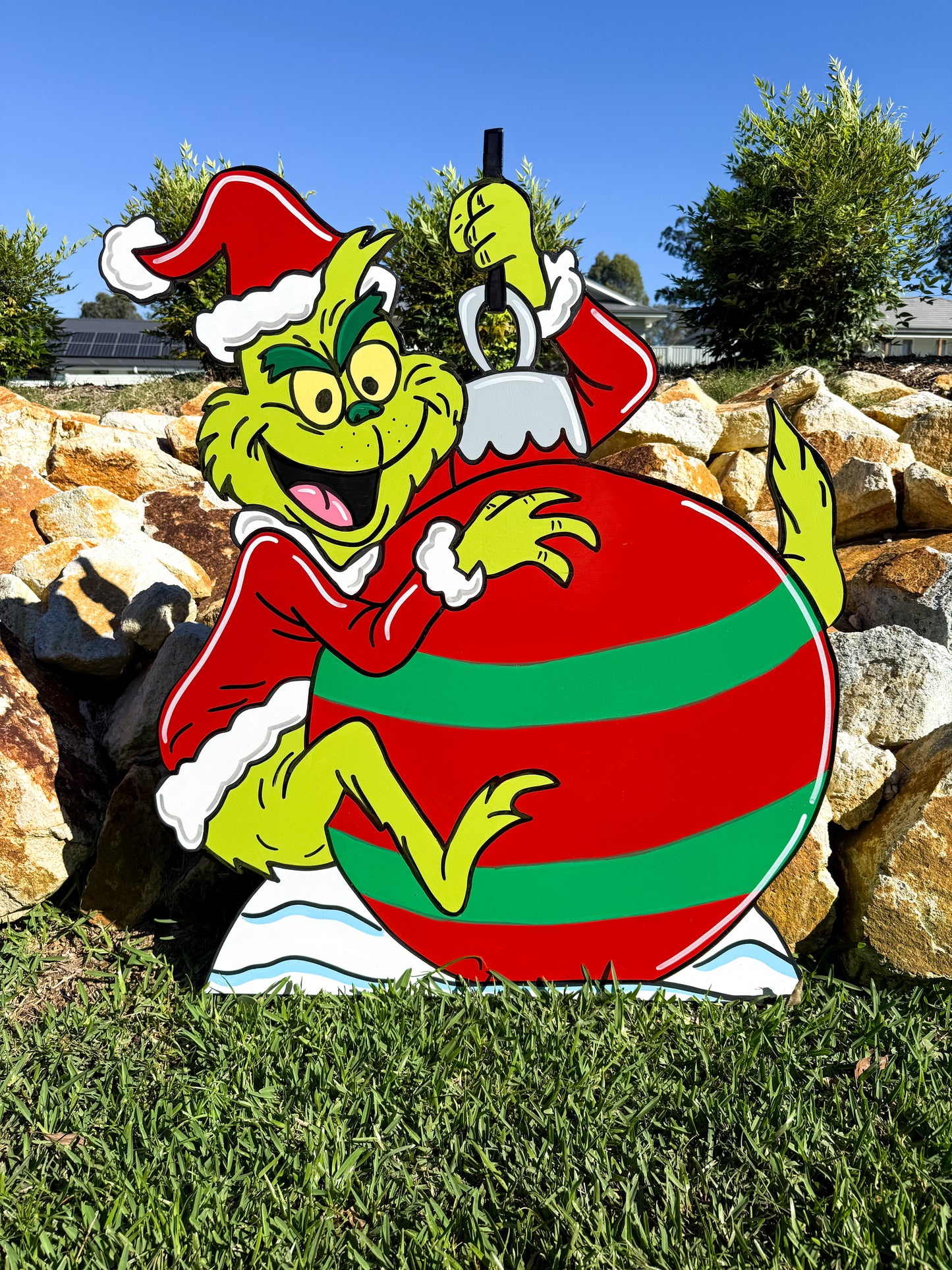 Grinch riding giant bauble Christmas