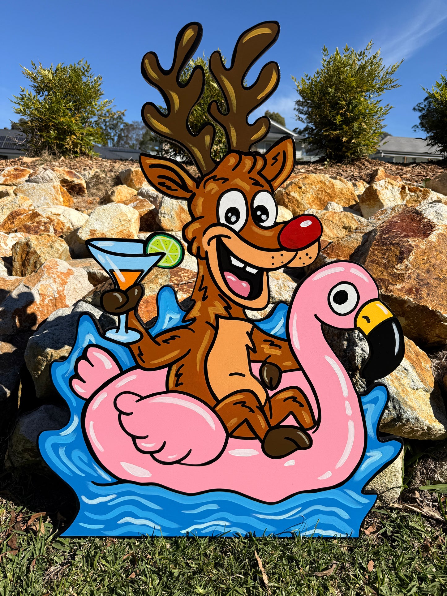 Reindeer on inflatable flamingo Christmas