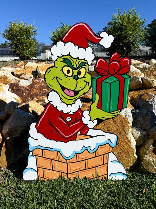 Grinch in Chimney with gift Christmas